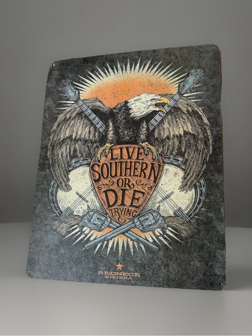 2014 John Rich retro-style "Live Southern Or Die Trying" metal tin sign.